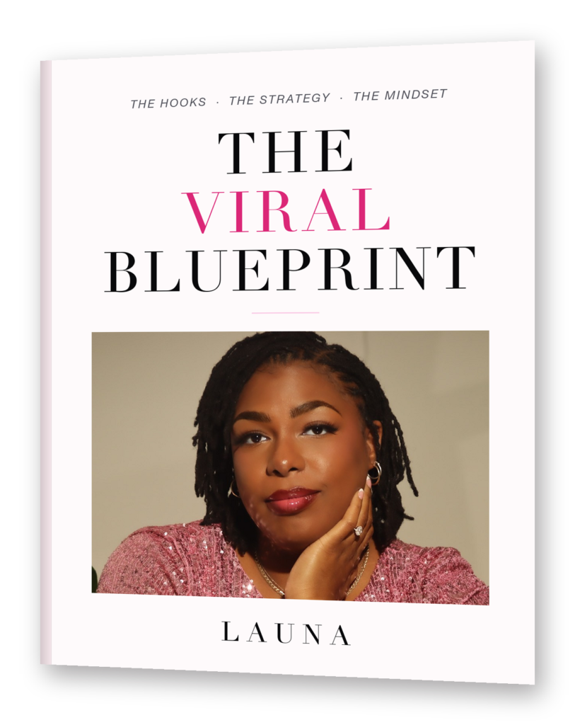 The Viral Blueprint guide, standing upright, with Launa on the cover
